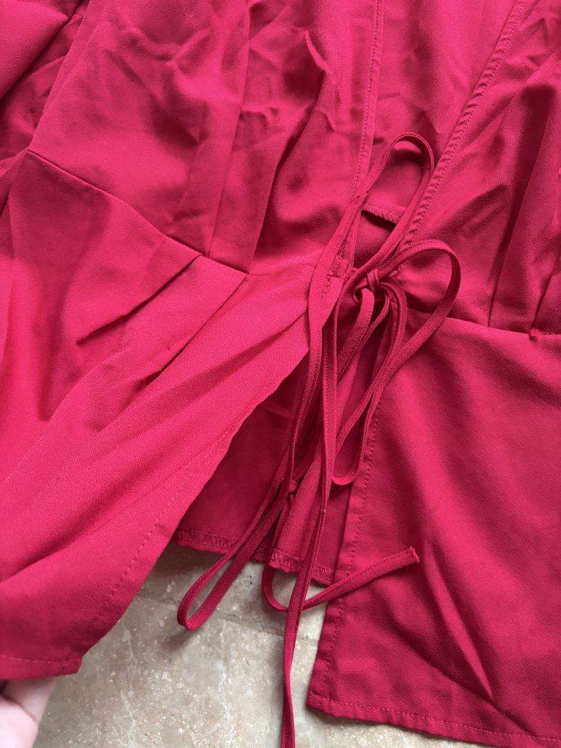 SM Woman Red Wrap-Tie Blouse (Category: Longsleeves) located in Quezon City. Submitted by tidyup.lara (Listing ID 1464862663, Image 2). Description: Size L Shoulder 15” Bust 34” Waist 30” Length 25” Condition 8/10: used but in good condition .