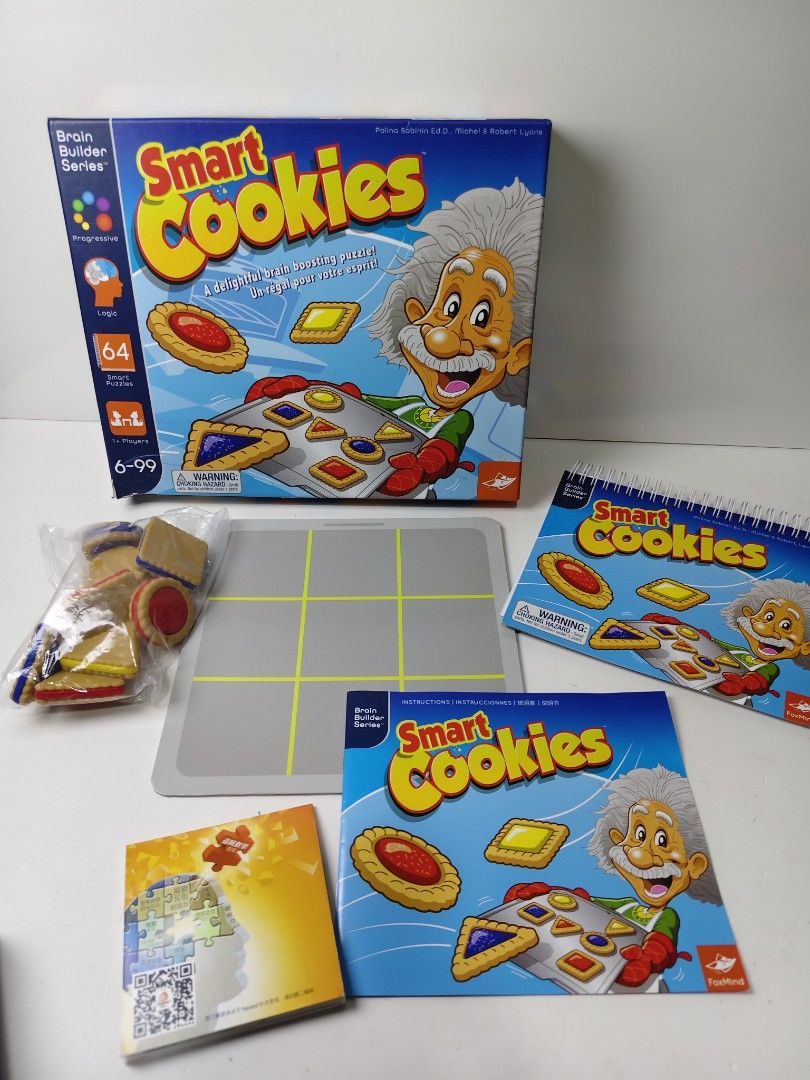 Smart Cookies Brain Boosting Puzzle Game FoxMind (Category: Board Games & Puzzles) located in Las Pinas. Submitted by mommy_14 (Listing ID 1464808401, Image 2). Description: - FoxMind Smart Cookies Brain Booster puzzle game - Features 64 smart logic puzzles for single players - Recommended for ages 6 to 99 - Complete set: includes game board, various cookie pieces, puzzle book, and instructions - Comes in its original box - Everything shown in th