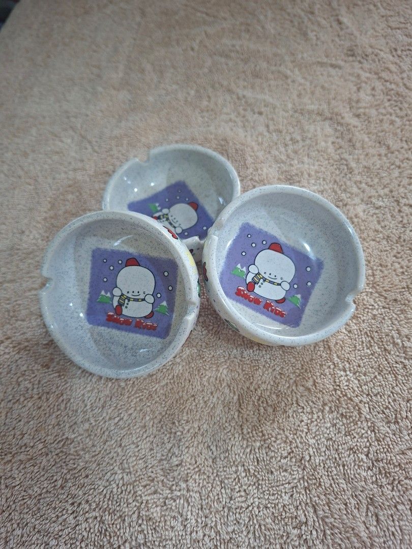 Snow Kids Small Ash Tray (Category: Other Stationery & Craft) located in Consolacion. Submitted by luxekerei (Listing ID 1464773723, Image 2). Description: - vintage ceramic ashtrays featuring a "Snow Kids" snowman illustration on a speckled stone-textured base..