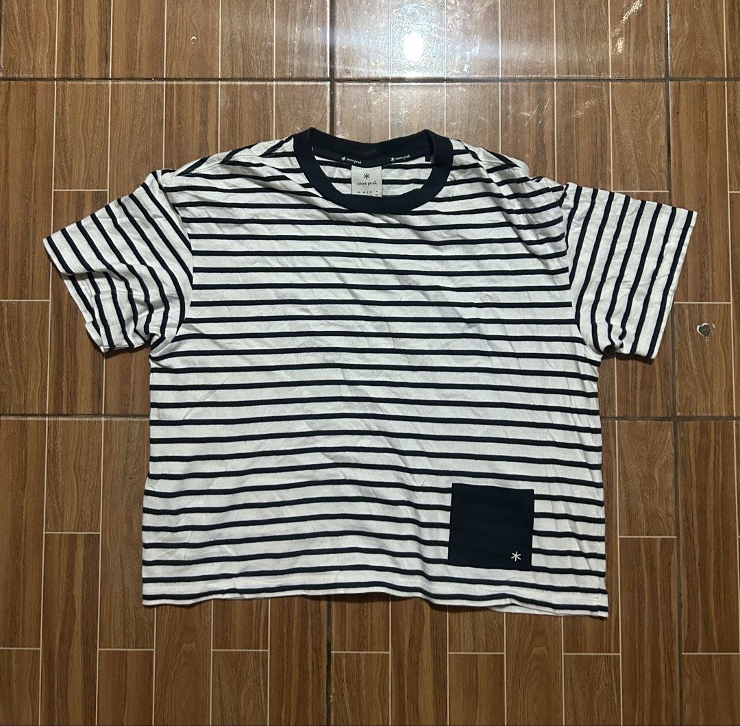 Snow Peak Striped Pocket T-Shirt (Category: Tshirts & Polo Shirts ) located in Cagayan de Oro. Submitted by aljay02 (Listing ID 1464772029, Image 2). Description: - Brand: Snow Peak - Color: White and Navy Striped - Size: Tagged US S / JP M - Measurements: ~23" chest / ~22" length - Details: Contrast dark crew neck, chest pocket with logo tag - Condition: Excellent casual wear for outdoor or indoor styling - Shipping: Ships fast via J&T .
