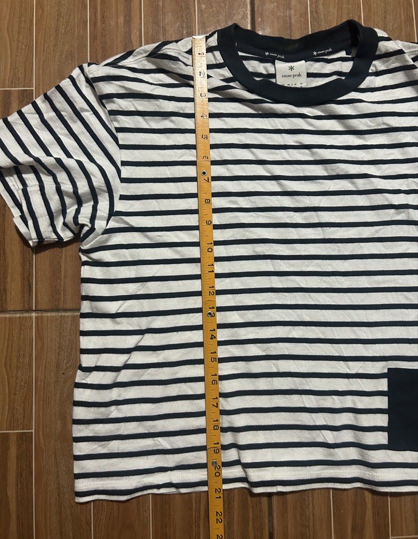 Snow Peak Striped Pocket T-Shirt (Category: Tshirts & Polo Shirts ) located in Cagayan de Oro. Submitted by aljay02 (Listing ID 1464772029, Image 3). Description: - Brand: Snow Peak - Color: White and Navy Striped - Size: Tagged US S / JP M - Measurements: ~23" chest / ~22" length - Details: Contrast dark crew neck, chest pocket with logo tag - Condition: Excellent casual wear for outdoor or indoor styling - Shipping: Ships fast via J&T .