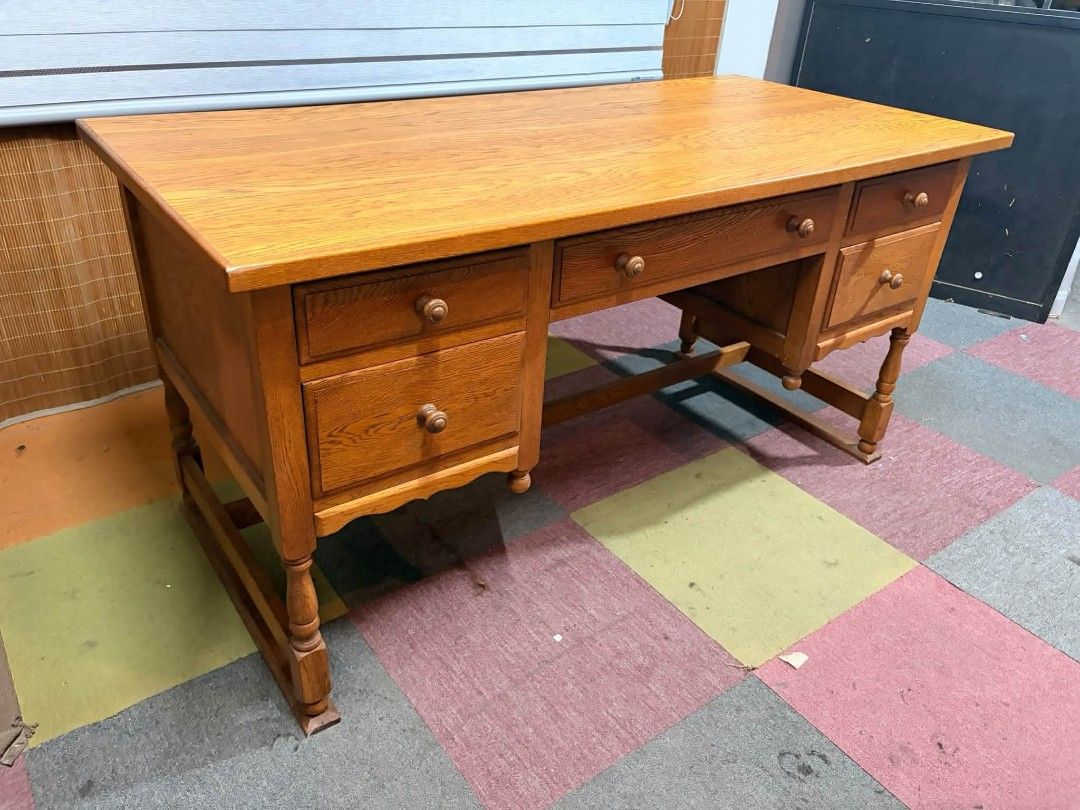 Solid Wood Executive Office Desk with Multiple Drawers (Category: Office Furniture & Fixtures) located in Antipolo. Submitted by roselle001 (Listing ID 1464886700, Image 2). Description: - Type: Large wooden office desk / study table - Finish: Warm honey wood finish - Storage: 6 total drawers (includes 1 wide middle drawer and deeper bottom drawers for extra storage) - Design: Classic turned wooden legs and matching knobs - Condition: Sturdy and 