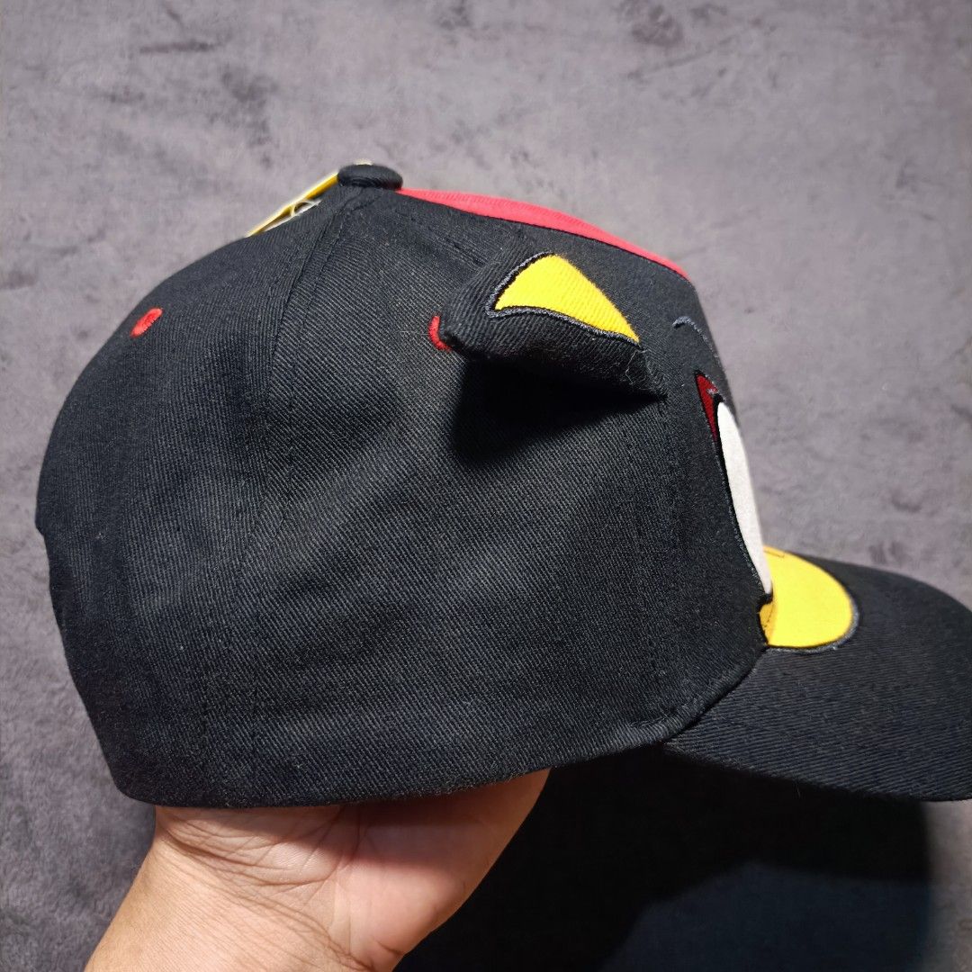 Sonic The Hedgehog Shadow Embroidered Baseball Cap (Category: Caps & Hats) located in Manila. Submitted by nye.seller (Listing ID 1464886813, Image 2). Description: - Official Sonic the Hedgehog merchandise - Features Shadow the Hedgehog's embroidered face and 3D ear details - Sleek black fabric with a striking red accent stripe on top - Brand new with original store tag attached - Standard adjustable cap fit for all-day comfort - A must-have col