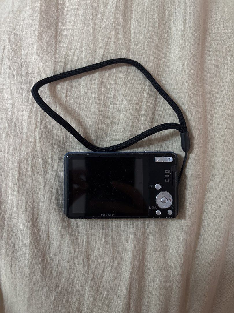 Sony Cyber-shot 14.1 Megapixels Digital Camera Blue (Category: Cameras) located in Manila. Submitted by empressbluemoon (Listing ID 1464842593, Image 3). Description: - Model: Sony Cyber-shot Digital Camera (Blue) - Resolution: 14.1 Megapixels - Lens: Carl Zeiss Vario-Tessar - Condition: Tested and working fine, minor scuffs on metal casing from normal use, clean lens glass - Features: Built-in flash - Inclusion: Black wrist strap attached.