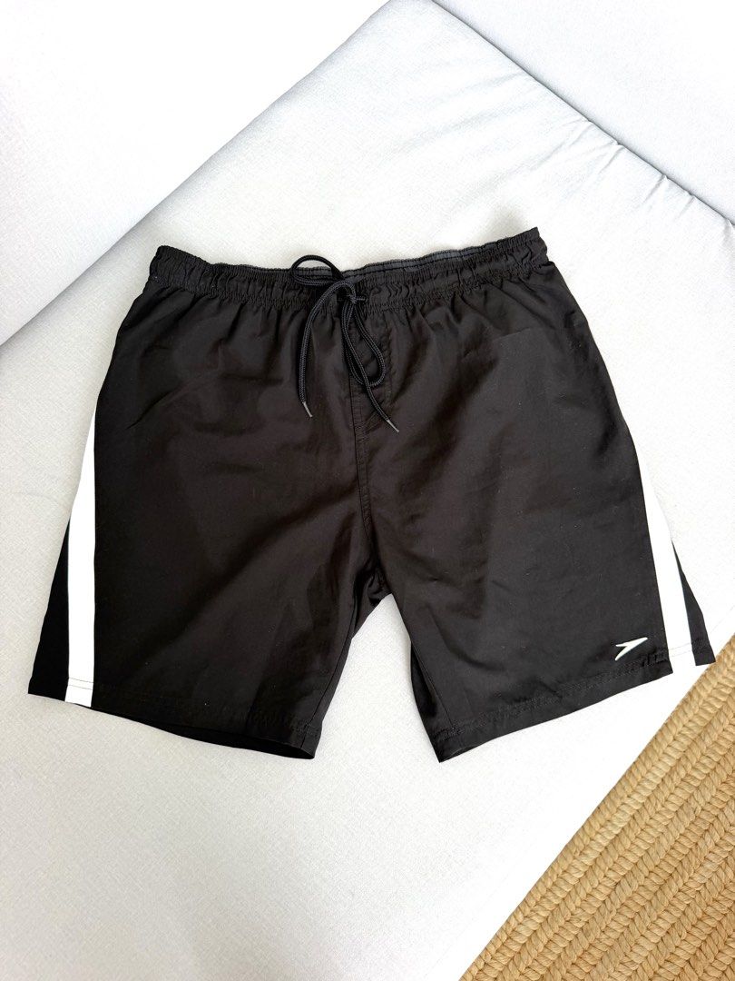 Speedo Black Swim Shorts Size L (Category: Swim Trunks & Board Shorts) located in Lipa City. Submitted by pauline0303 (Listing ID 1464772369, Image 1). Description: - Brand: Speedo - Color: Black - Size: L - Design: White stripe details on sides and back - Waistband: Elastic with drawstring for a secure fit - Interior: Built-in mesh lining - Ideal for: Swimming, beach trips, or casual lounging.