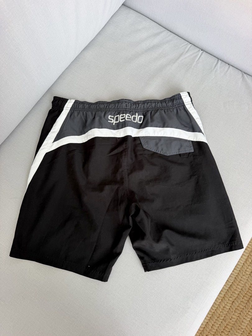 Speedo Black Swim Shorts Size L (Category: Swim Trunks & Board Shorts) located in Lipa City. Submitted by pauline0303 (Listing ID 1464772369, Image 3). Description: - Brand: Speedo - Color: Black - Size: L - Design: White stripe details on sides and back - Waistband: Elastic with drawstring for a secure fit - Interior: Built-in mesh lining - Ideal for: Swimming, beach trips, or casual lounging.