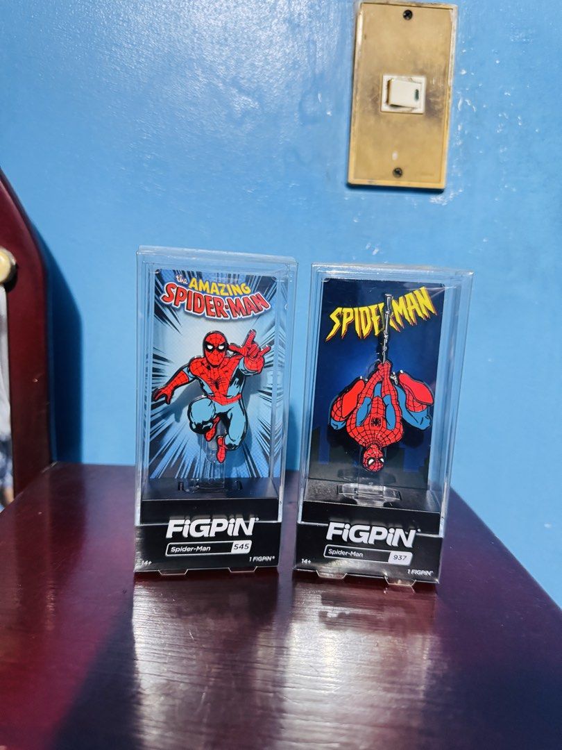 Spider-Man FigPIN 545 and 937 Set (Category: Figurines & Statues) located in Malabon City. Submitted by wilbert.te (Listing ID 1464774231, Image 1). Description: - Set of 2 official Spider-Man collectors pins in clear acrylic display cases - Includes The Amazing Spider-Man #545 (action pose) and #937 (hanging upside down) - Both come with original black base stands and front labels - Great addition for Marvel fans and pin collectors - Excellent d
