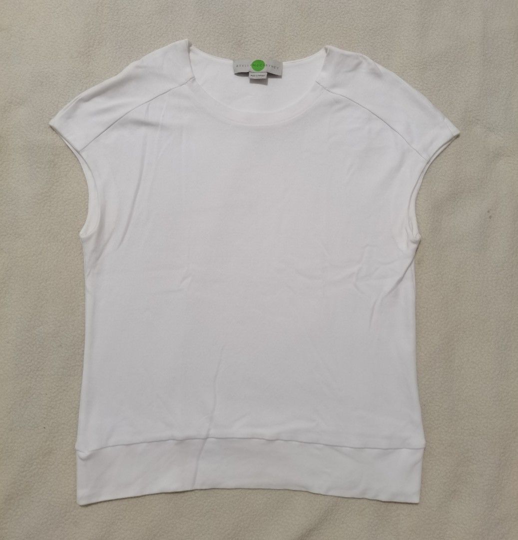 Stella McCartney Luxury Cap-Sleeve White Tee (Category: Sleeveless) located in Santa Cruz. Submitted by oddpenguin-4575 (Listing ID 1464936760, Image 2). Description: 📌.....P L E A S E R E A D..... 📌measurement:Laid flat Sh-21.5"/Sleeve-10"/Chest-18"/Lenght-23.5"/armhole-6"/armpit-__ 📌size:Filipino Women's Size Small to Medium (S/M) for a standard fitted look, or a Size Small (S) if you prefer a slightly relaxed, draped fit. 📌color-9/10 📌 Br