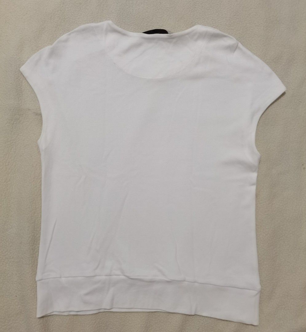 Stella McCartney Luxury Cap-Sleeve White Tee (Category: Sleeveless) located in Santa Cruz. Submitted by oddpenguin-4575 (Listing ID 1464936760, Image 3). Description: 📌.....P L E A S E R E A D..... 📌measurement:Laid flat Sh-21.5"/Sleeve-10"/Chest-18"/Lenght-23.5"/armhole-6"/armpit-__ 📌size:Filipino Women's Size Small to Medium (S/M) for a standard fitted look, or a Size Small (S) if you prefer a slightly relaxed, draped fit. 📌color-9/10 📌 Br