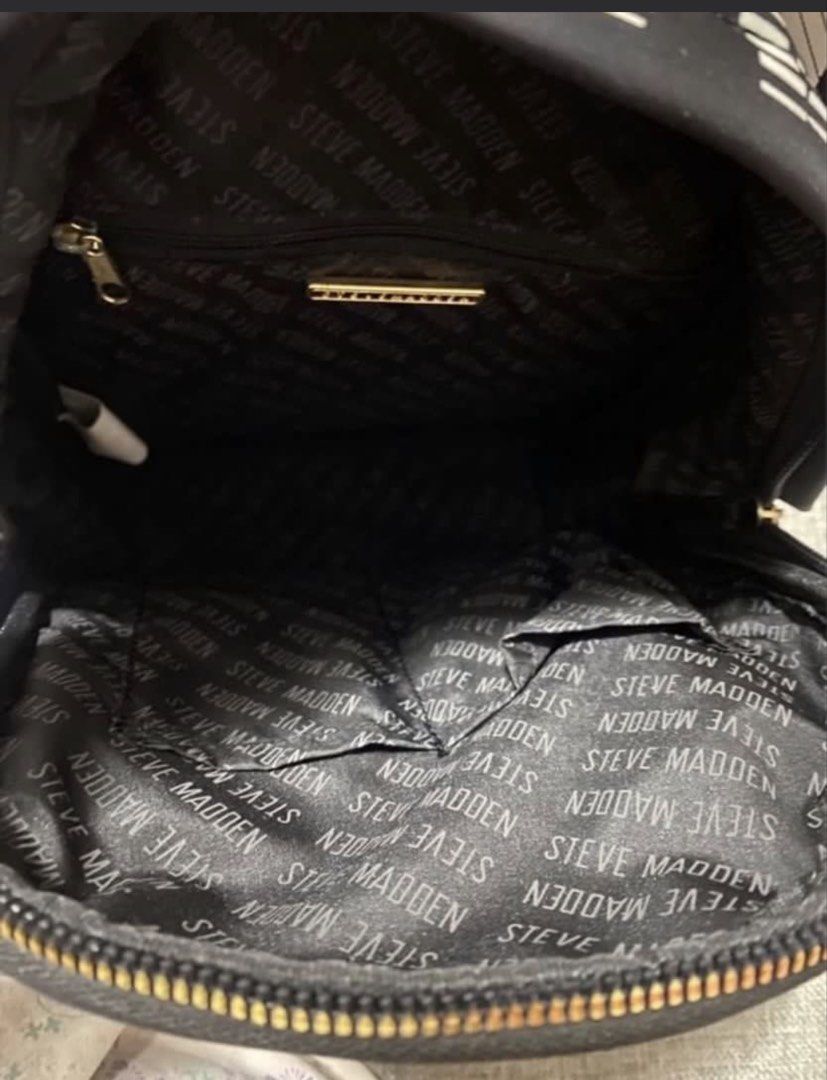 Steve Madden backpack (Category: Backpacks) located in Manila. Submitted by bwshoppe (Listing ID 1464915237, Image 3). Description: STEVE MADDEN black backpack (small size) with 1 zip pocket infront, 1 zip pocket back, 1 inner zip pocket & 2 inner slip on pockets Made of Nylon similar to longchamp fabric texture (water repellant)& light to carry. Purchased in US Outlet Mall . .