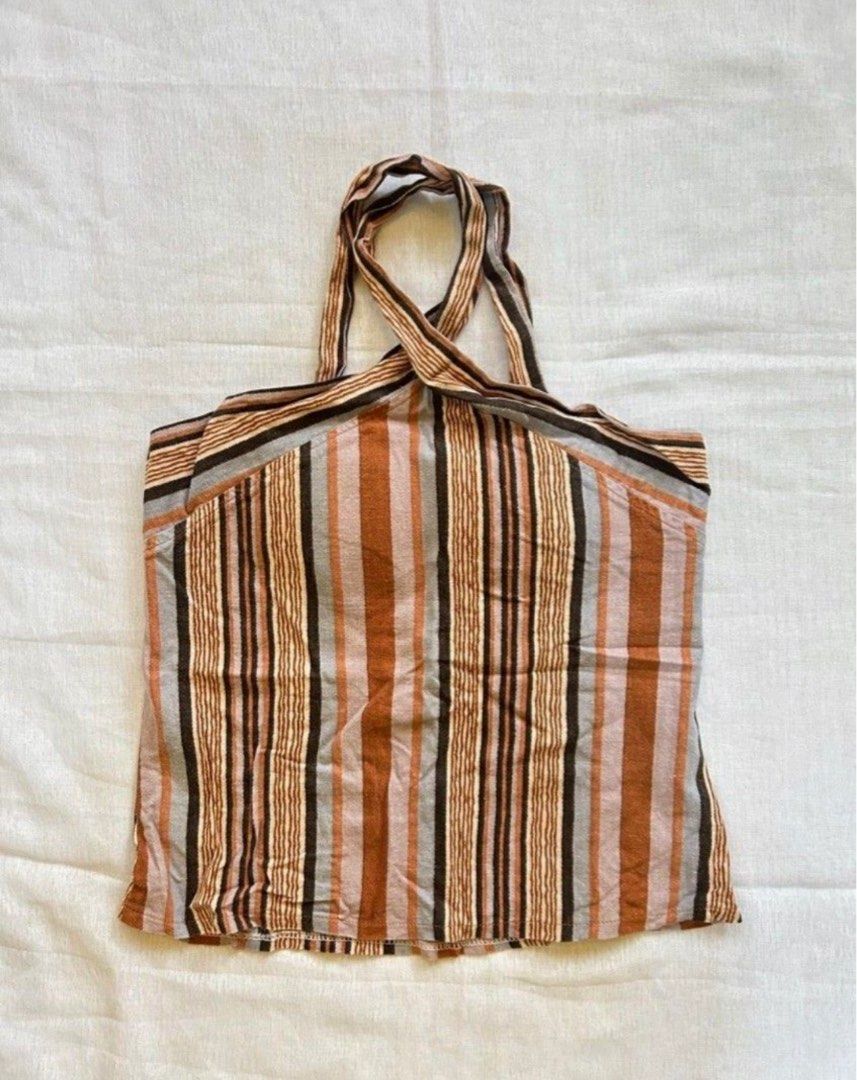 Striped Halter Top (Category: Sleeveless) located in Quezon. Submitted by itsjl (Listing ID 1464870627, Image 1). Description: Striped halter top with a chic cross-strap neck and straight hem. Perfect for warm weather esp the beach, easy to match with denim shorts or skirts Very nice but have to let it go kasi it doesn’t fit me well :( Still negotiable.