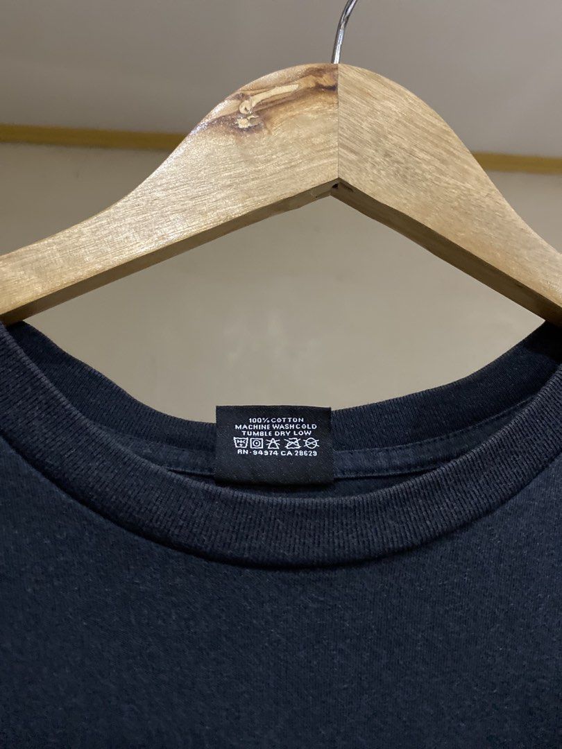 Stüssy Black Graphic Tee Size XL (Category: Tshirts & Polo Shirts ) located in Rizal. Submitted by channzy (Listing ID 1464920372, Image 3). Description: - Brand: Stüssy - Color: Black - Size: XL (Standard Fit) - Material: 100% Cotton (Machine wash cold, tumble dry low) - Design: Small white signature logo on left chest, large signature graffiti logo on back - Details: Crew neck, short sleeves, clean inner tags - Condition: 100% authentic and wel