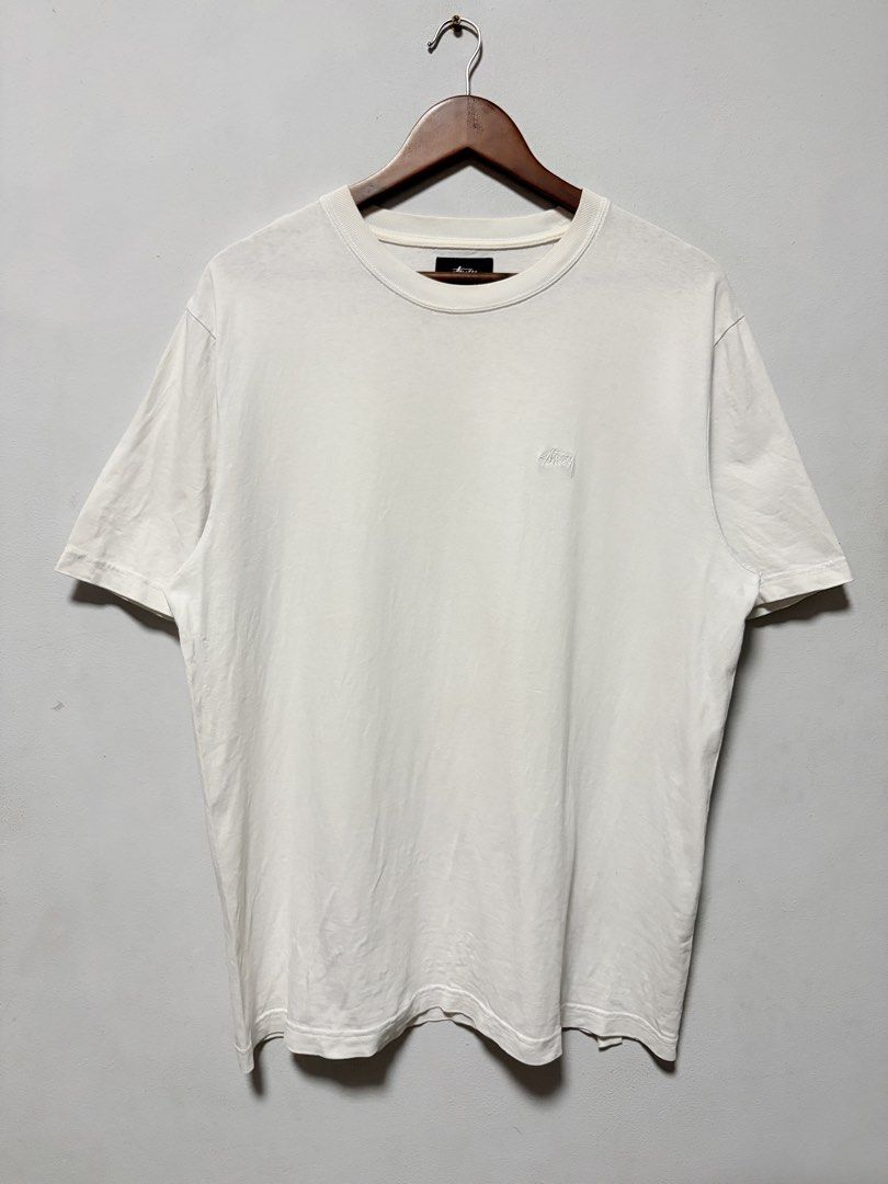 Stussy Side Logo White Tee (Authentic) (Category: Tshirts & Polo Shirts ) located in Calamba. Submitted by jim.ibe066 (Listing ID 1464871723, Image 1). Description: Stussy Side Logo White Tee (Authentic) Size Medium - Large width 22.5 length 28 Excellent condition 9.5/10 condition and color rate -Still in excellent condition no any stains or yellow stains and no any pinholes Issue: None.