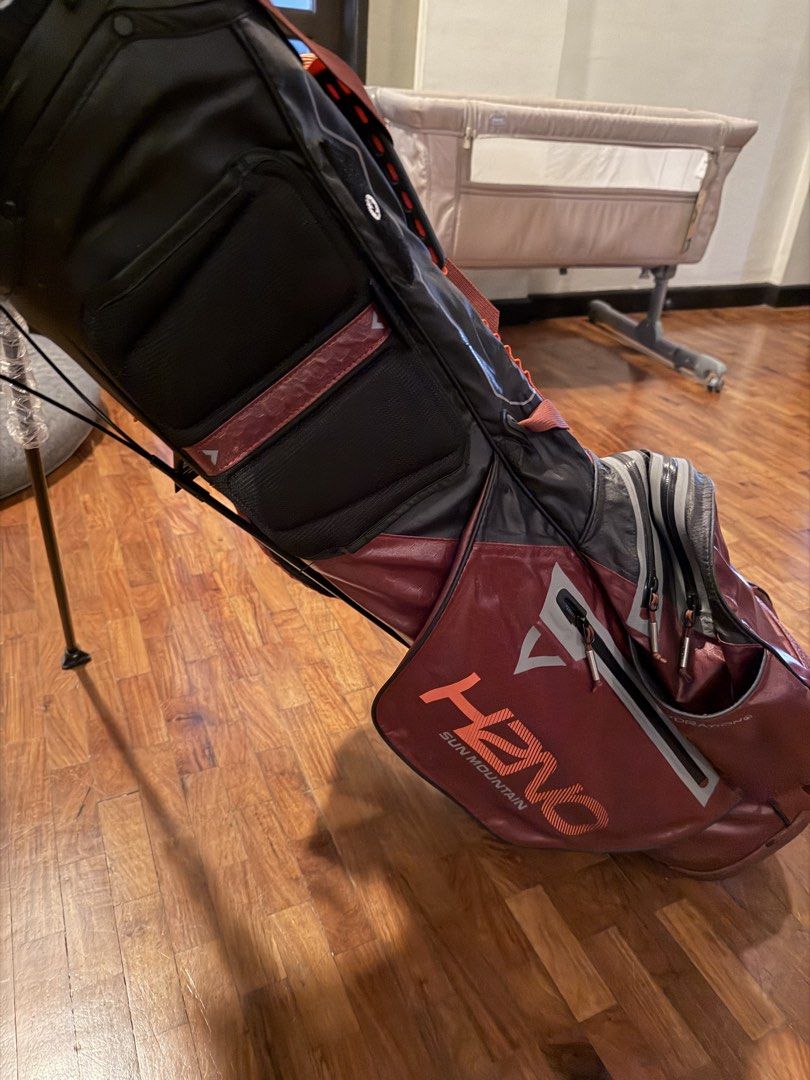 Sun Mountain Golf Bag (Category: Golf) located in Marikina City. Submitted by studiogammo (Listing ID 1464774686, Image 1). Description: - Brand: Sun Mountain H2NO Lite Stand Bag - Colorway: Black, Garnet, and Inferno - Condition: Brand new with original hang tag attached and plastic wrapping still on stand legs - Waterproof: Fully waterproof construction with sealed taped zippers - Storage: Multiple zippered pockets for apparel and gear - Comfor