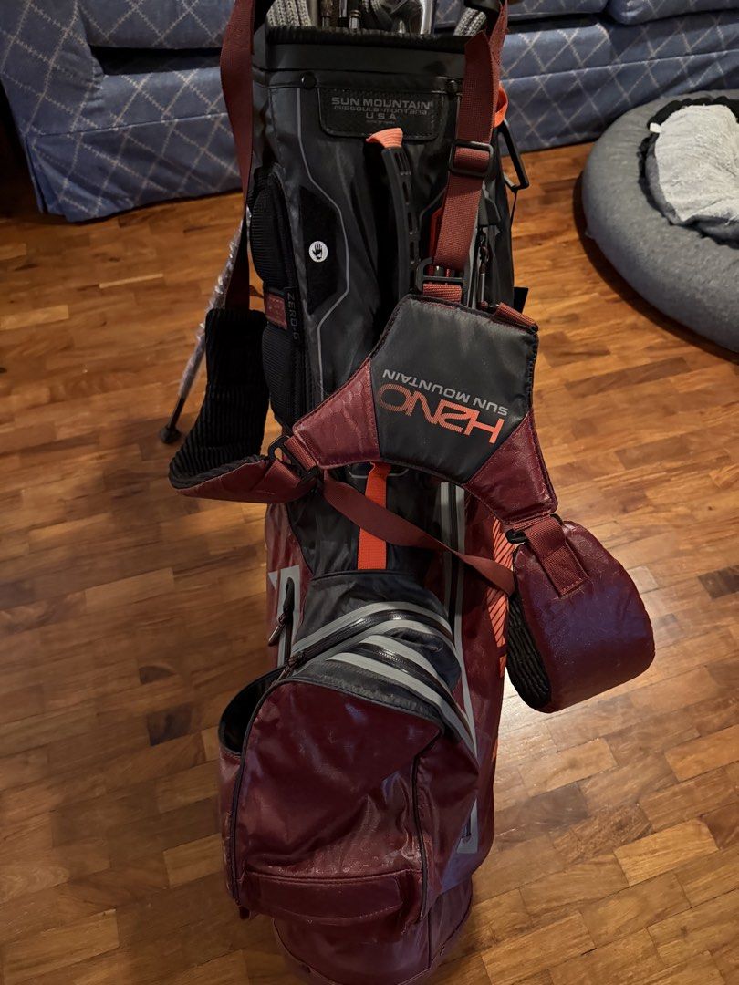 Sun Mountain Golf Bag (Category: Golf) located in Marikina City. Submitted by studiogammo (Listing ID 1464774686, Image 3). Description: - Brand: Sun Mountain H2NO Lite Stand Bag - Colorway: Black, Garnet, and Inferno - Condition: Brand new with original hang tag attached and plastic wrapping still on stand legs - Waterproof: Fully waterproof construction with sealed taped zippers - Storage: Multiple zippered pockets for apparel and gear - Comfor