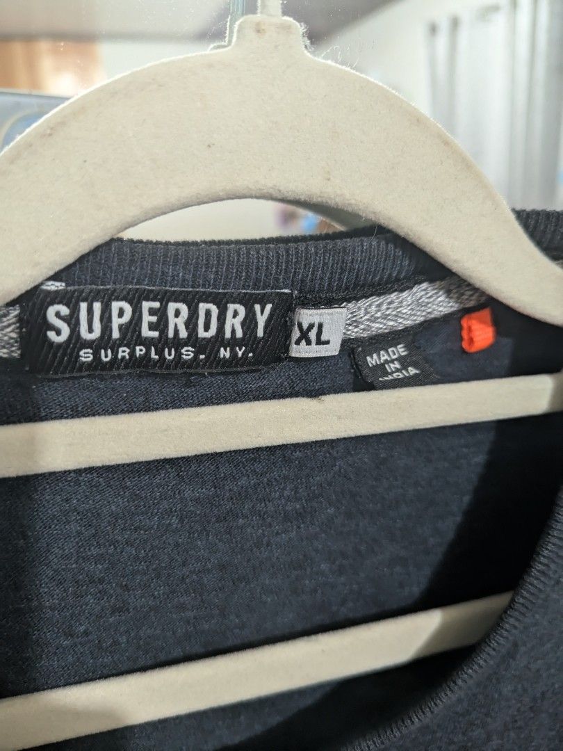 Super dry pocket tee (Category: Activewear) located in Labo. Submitted by ronelryan (Listing ID 1464883897, Image 2). Description: Xl on tag 21 x 28.