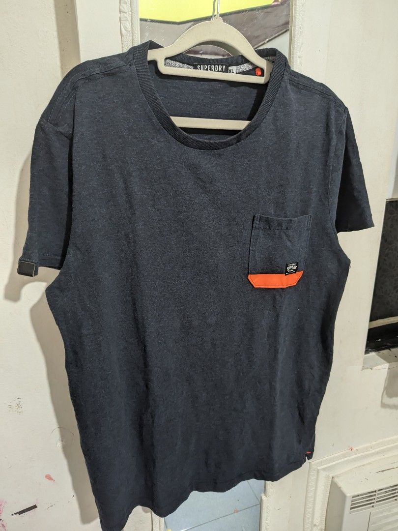 Super dry pocket tee (Category: Activewear) located in Labo. Submitted by ronelryan (Listing ID 1464883897, Image 1). Description: Xl on tag 21 x 28.