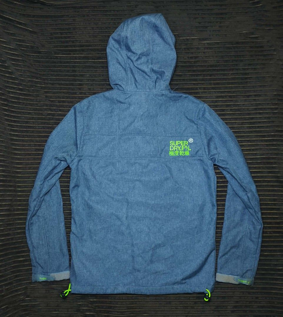 Superdry Original Windtrekker Japan Jacket Size M (Category: Coats, Jackets and Outerwear) located in Manila. Submitted by norathrifted (Listing ID 1464800987, Image 2). Description: - Authentic Superdry Original Windtrekker Japan jacket - Color: Stylish blue marl with striking neon green fleece lining and matching zippers - Size: Men's Medium (M) - Features an attached hood with adjustable drawstrings - Secure storage with front zip pockets and 