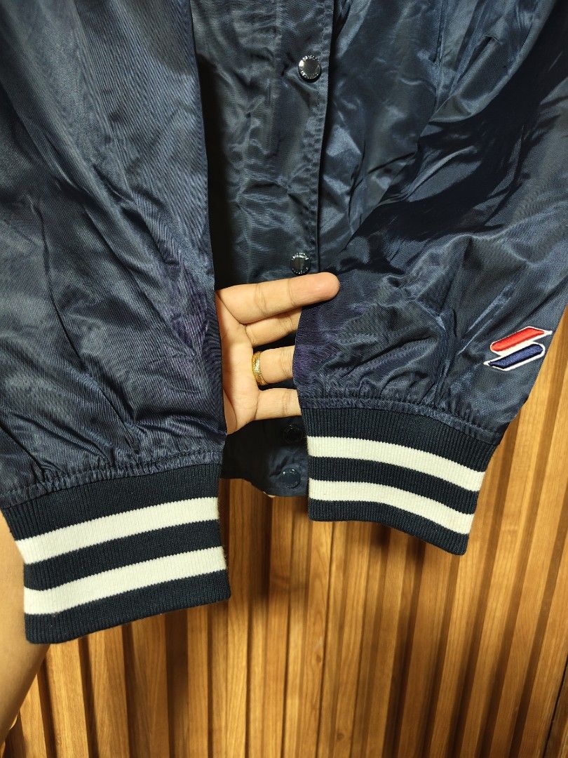 SUPERDRY VARSITY JACKET (Category: Coats, Jackets and Outerwear) located in San Fernando. Submitted by SungkiThrift (Listing ID 1464800119, Image 3). Description: 🔥 FOR SALE — SUPERDRY VARSITY JACKET 🔥 🖤 Navy Blue Superdry jacket ✨ Classic varsity/bomber style 🏷️ Superdry embroidered details & patches 📏 Measurements: 20.5" pit-to-pit × 24.5" length 🧥 With pockets, snap buttons & striped ribbed cuffs 👌 Good condition — minimal signs of use,