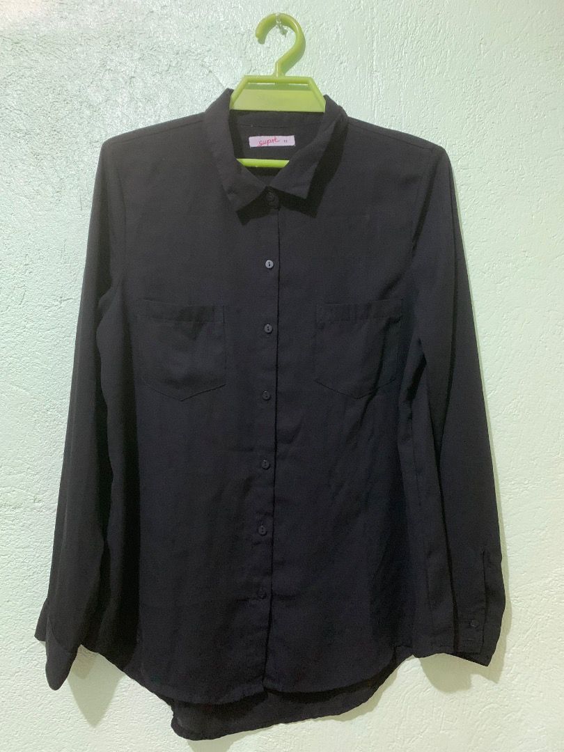 Supré Black Button-Up Long Sleeve Shirt Size 12 (Category: Longsleeves) located in Daraga. Submitted by ryrilim (Listing ID 1464924151, Image 1). Description: - Brand: Supré - Size: AU/UK 12 - Color: Solid black - Material: Lightweight and comfortable fabric - Features: Long sleeves, standard collar, two chest pockets, curved hem - Style: Versatile basic piece, easy to match with any outfit - Condition: Excellent, ready to wear.