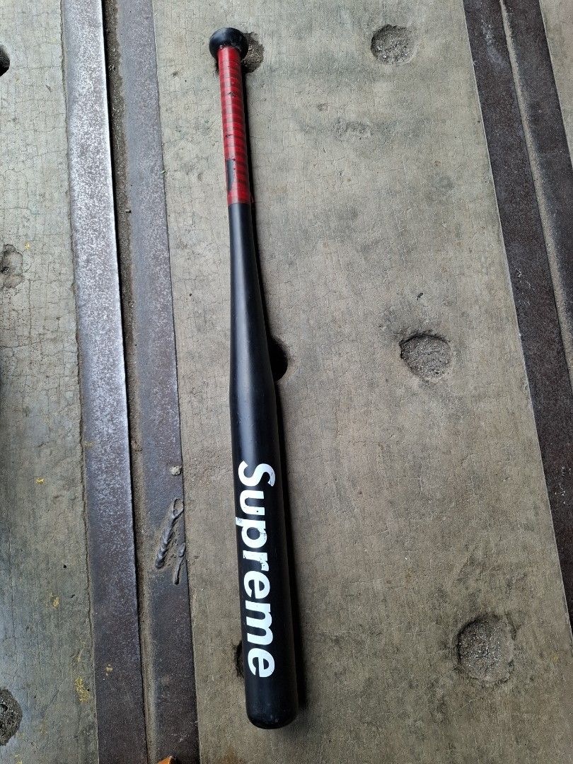 Supreme Black Baseball Bat (Category: Racket and Ball Sports) located in Manila. Submitted by rocksolid227 (Listing ID 1464789685, Image 1). Description: - Color/Design: Black bat with iconic white Supreme logo near the end - Handle: Red grip tape with minor wear, secured with electrical tape - Material/Size: Solid build, standard size - Condition: Pre-loved, great for collection or casual practice - Meetups and shipping options available within 