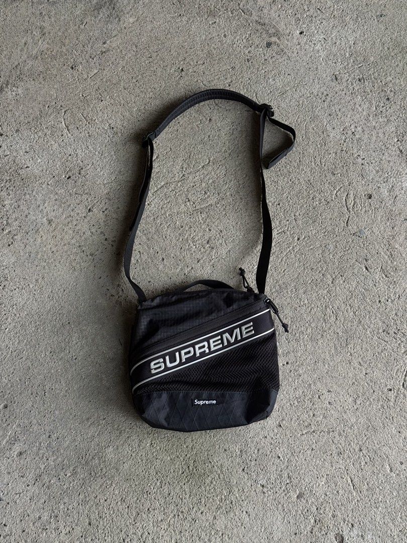 Supreme FW23 Black Shoulder Bag (Category: Sling Bags) located in Manila. Submitted by yamborghini22 (Listing ID 1464774334, Image 1). Description: Supreme FW23 Black Shoulder Bag Water resistant nylon ripstop with X-Pac® laminated base and 3M® Reflective molded logo webbing. 4L. Pristine condition ₱4500✨ .