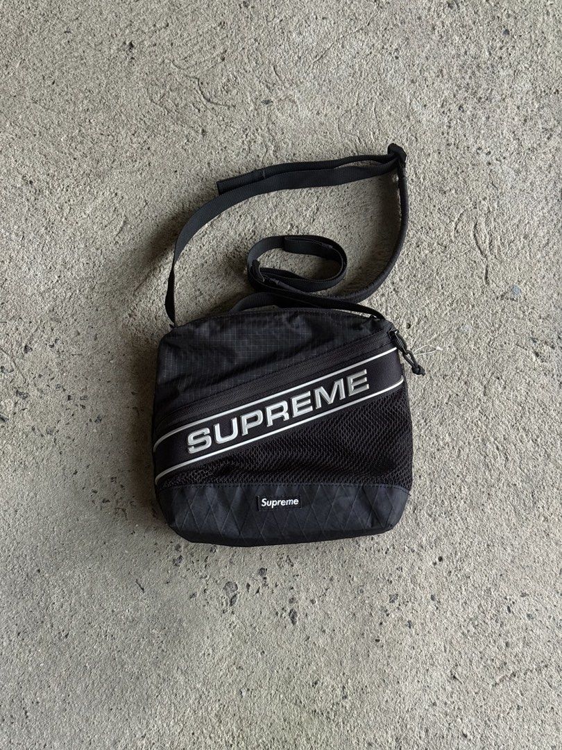 Supreme FW23 Black Shoulder Bag (Category: Sling Bags) located in Manila. Submitted by yamborghini22 (Listing ID 1464774334, Image 3). Description: Supreme FW23 Black Shoulder Bag Water resistant nylon ripstop with X-Pac® laminated base and 3M® Reflective molded logo webbing. 4L. Pristine condition ₱4500✨ .