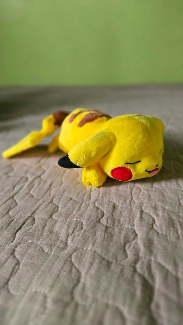 Takara Tomy Sleeping Pikachu Pokémon Plush Toy (Category: Plushies & Soft Toys) located in Baguio. Submitted by je_ver_lyn16 (Listing ID 1464844801, Image 2). Description: - Official Takara Tomy Sleeping Pikachu plush - Features bright yellow fabric, embroidered face, and classic lightning tail - Equipped with hard plastic clips on the front paws for easy attachment - Clean fur and kept in a smoke-free home - Tag attached, perfect for collectors.