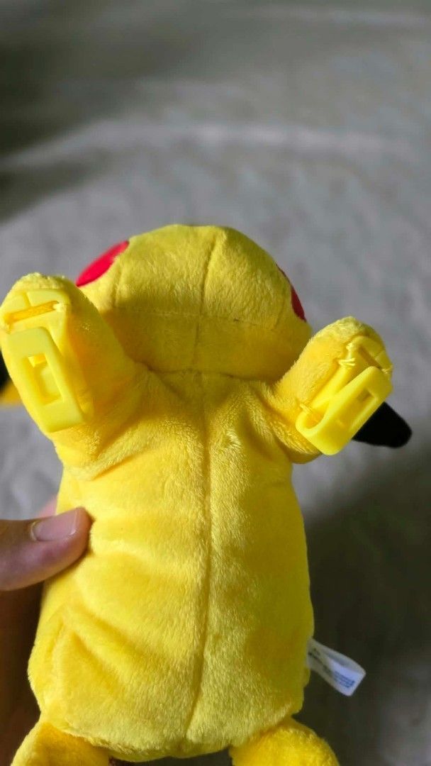 Takara Tomy Sleeping Pikachu Pokémon Plush Toy (Category: Plushies & Soft Toys) located in Baguio. Submitted by je_ver_lyn16 (Listing ID 1464844801, Image 3). Description: - Official Takara Tomy Sleeping Pikachu plush - Features bright yellow fabric, embroidered face, and classic lightning tail - Equipped with hard plastic clips on the front paws for easy attachment - Clean fur and kept in a smoke-free home - Tag attached, perfect for collectors.