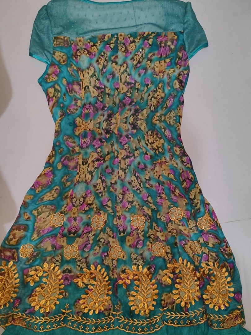 teal short-sleeved mini dress (Category: Dresses) located in Iloilo. Submitted by cynehllevie (Listing ID 1464957062, Image 2). Description: 🍥teal short-sleeved mini dress with a patterned body, mesh neckline, and gold embroidered paisley hem. 🍥good as new 🍥s-m 🍥 really pretty I swear! 🍥no flaws/issues.