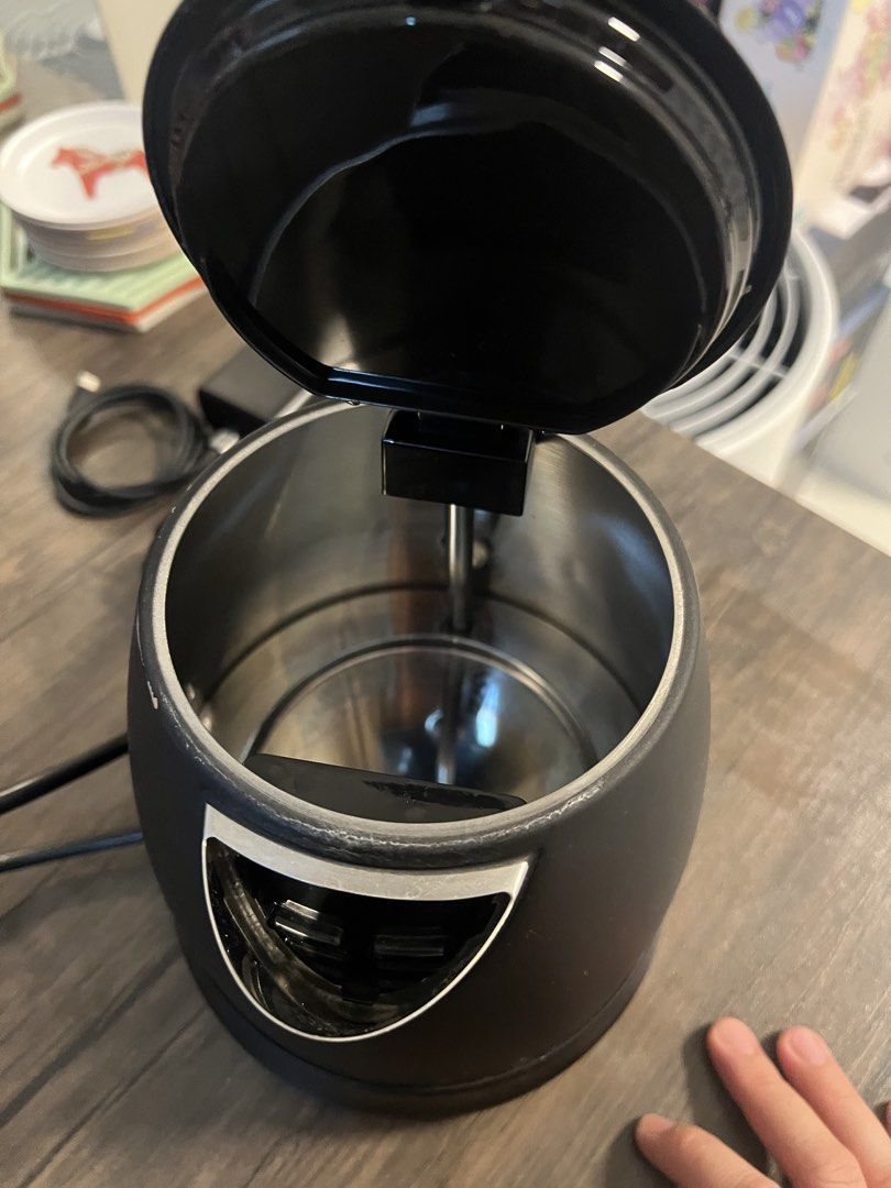 Tefal Black Electric Kettle (Category: Kettles & Airpots) located in Cainta. Submitted by hunchester (Listing ID 1464897187, Image 3). Description: - Brand: Tefal - Color/Finish: Black with a matte body and silver accents - Interior: Stainless steel - Features: Wide-opening hinged lid for easy filling, integrated switch on the handle - Condition: Fully working and tested - Included: Standard power cord.