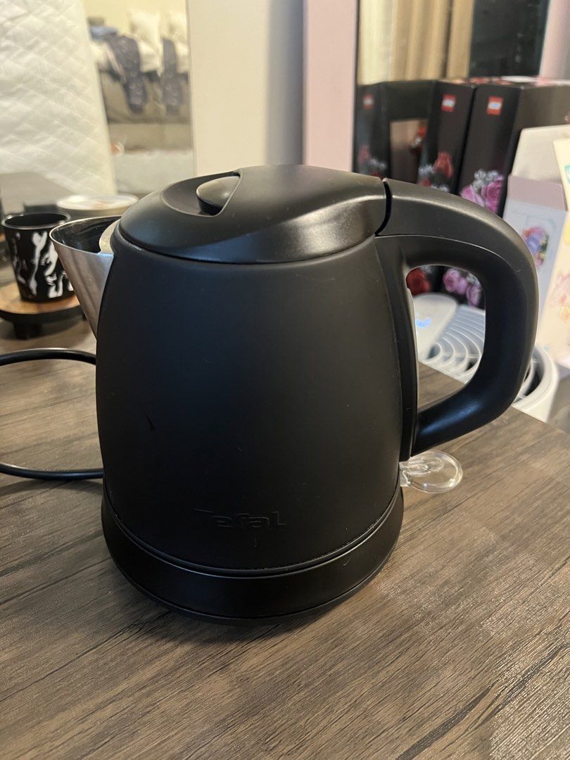 Tefal Black Electric Kettle (Category: Kettles & Airpots) located in Cainta. Submitted by hunchester (Listing ID 1464897187, Image 1). Description: - Brand: Tefal - Color/Finish: Black with a matte body and silver accents - Interior: Stainless steel - Features: Wide-opening hinged lid for easy filling, integrated switch on the handle - Condition: Fully working and tested - Included: Standard power cord.