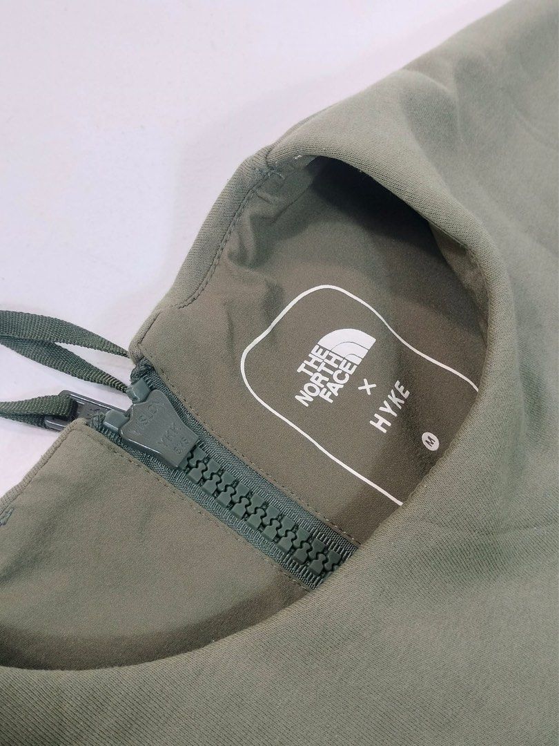 The North Face Olive Green Long Sleeve Pullover (Category: Coats, Jackets and Outerwear) located in Manila. Submitted by yesterdaysfinds (Listing ID 1464854016, Image 3). Description: NorthFace x Hyke Condition : Verygood to Excellent Color : Armygreen size : Medium Dimension 👇 Chest : 25 Lenght : 28 Shoulder : 23 Sleeve : 20 📌 - Brand: The North Face - Color: Olive green - Fit: Relaxed fit with long sleeves - Details: Round neckline, small whi