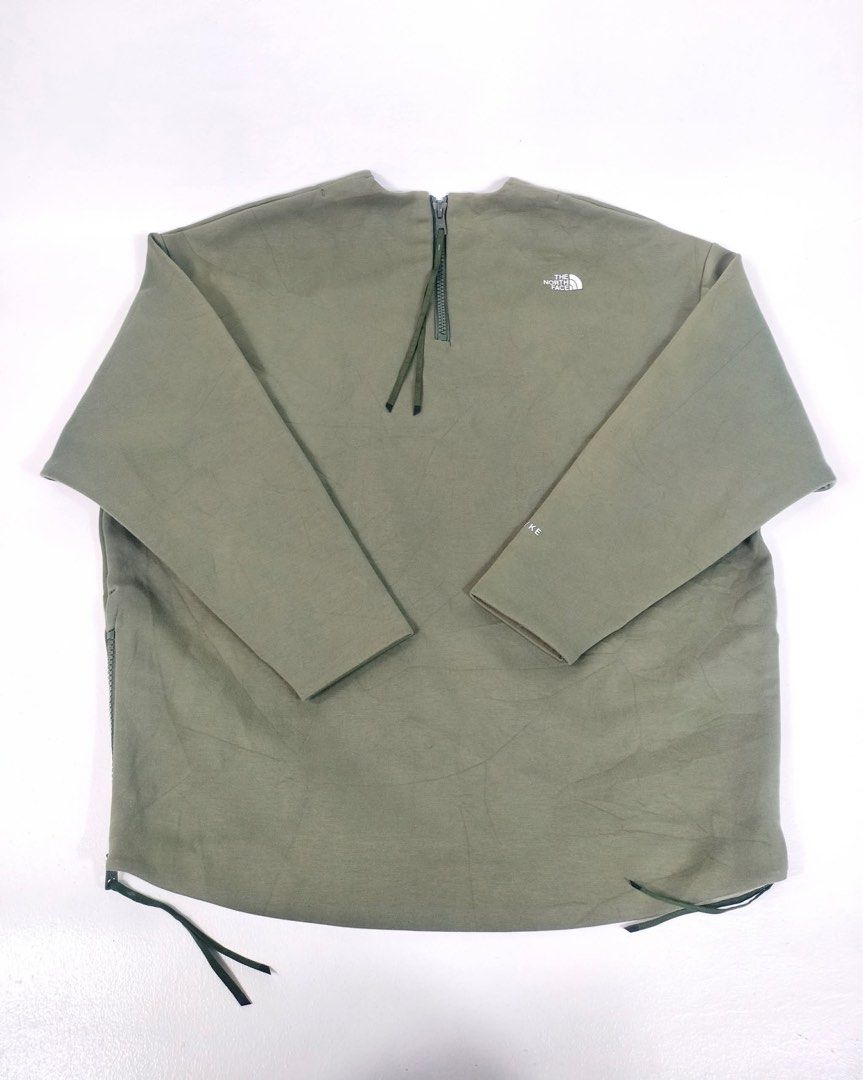 The North Face Olive Green Long Sleeve Pullover (Category: Coats, Jackets and Outerwear) located in Manila. Submitted by yesterdaysfinds (Listing ID 1464854016, Image 2). Description: NorthFace x Hyke Condition : Verygood to Excellent Color : Armygreen size : Medium Dimension 👇 Chest : 25 Lenght : 28 Shoulder : 23 Sleeve : 20 📌 - Brand: The North Face - Color: Olive green - Fit: Relaxed fit with long sleeves - Details: Round neckline, small whi