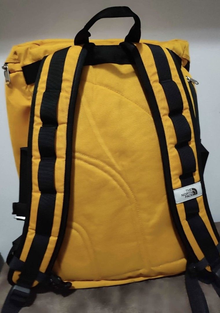 The North Face TNF Alpha Box Backpack Yellow (Category: Backpacks) located in Davao. Submitted by rodrigoani57168 (Listing ID 1464802641, Image 3). Description: - Brand: The North Face Alpha Box Backpack - Color: Bright yellow with black webbing details - Condition: Clean interior and exterior - Features: Roomy main compartment with top zipper and internal organizing pockets - Comfort: Padded back straps - Best for: Daily commute, school, or trav
