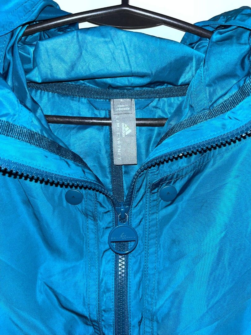 This is the blue Adi by Stella McCartney Athletics Light Pull-On Jacket (Category: Coats, Jackets and Outerwear) located in Iba. Submitted by clctvph (Listing ID 1464966551, Image 2). Description: This is the blue Adi by Stella McCartney Athletics Light Pull-On Jacket Size L on tag Color rate 10/10 Issue: NONE IN GREAT CONDITION💯 985 pesos only‼️.