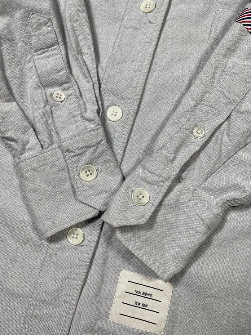 Thom Browne 4-Bar Stripe Oxford (Category: Formal Shirts) located in Caloocan City. Submitted by dapreluv (Listing ID 1464924938, Image 2). Description: Thom Browne 4-Bar Stripe Oxford Brand: Thom Browne New York Product Style / Code: ⁠FLL099A-06177-035⁠ (also listed as ⁠FLL099A 06177035⁠) Item Description: Thom Browne 4-Bar Stripe Oxford Cotton Button-Down Shirt with Armband Size: 40 (equivalent to IT 40 / US Small / Thom Browne size 1) Fabric C
