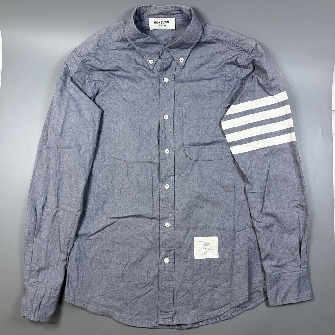 Thom Browne - Chambray 4-Bar Shirt Grey (Category: Luxury Apparel) located in Paranaque City. Submitted by millennial_goodz (Listing ID 1464893187, Image 1). Description: WTS Thom Browne - Chambray 4-Bar Shirt Grey Size 1 Dimensions: 19" / 29" Excellent condition Ready to wear P2,499 only DM.