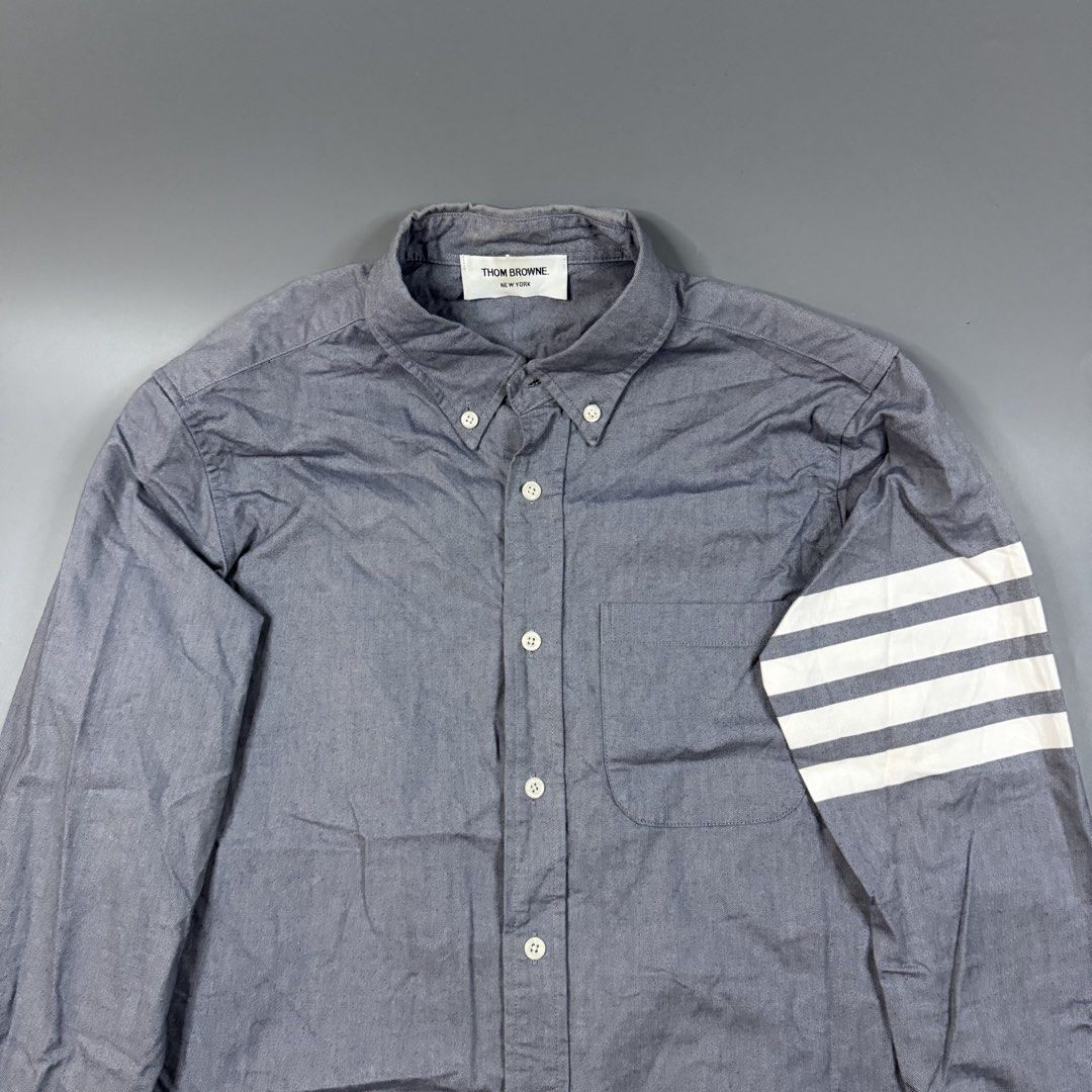 Thom Browne - Chambray 4-Bar Shirt Grey (Category: Luxury Apparel) located in Paranaque City. Submitted by millennial_goodz (Listing ID 1464893187, Image 3). Description: WTS Thom Browne - Chambray 4-Bar Shirt Grey Size 1 Dimensions: 19" / 29" Excellent condition Ready to wear P2,499 only DM.
