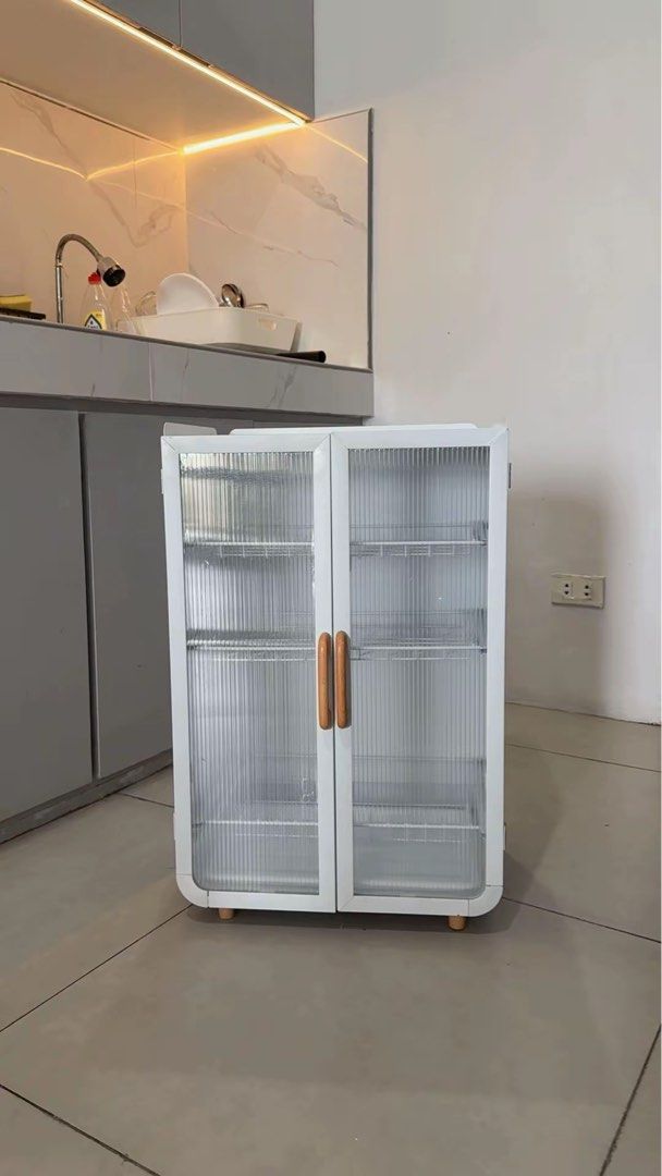Three Tier White Dish Rack Kitchen Cabinet (Category: Food Organization & Storage) located in Manila. Submitted by iravillone31747 (Listing ID 1464805129, Image 1). Description: Pa dm ako for video, may super minimal dents due to delivery, selling super low.