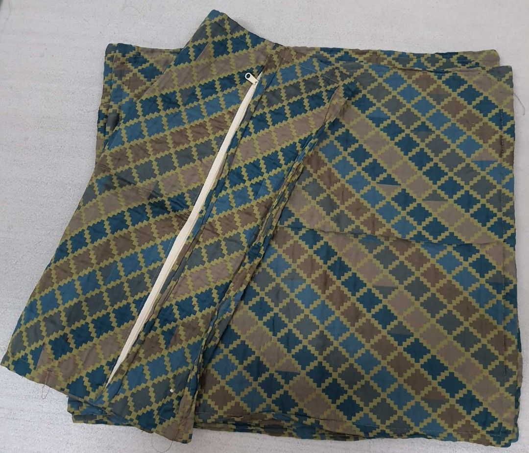 Throw pillow cover (Category: Cushions & Throws) located in Caloocan City. Submitted by 211sc (Listing ID 1464832379, Image 1). Description: - Item: Throw pillow cover - Design: Geometric checkered pattern in blue and greenish-brown tones - Condition: Used for 1 year, then properly kept in storage - Features: Convenient zipper closure for easy insertion and removal of pillows - Ideal for upgrading living room or bedroom aesthetic - Size 44cmx44cm