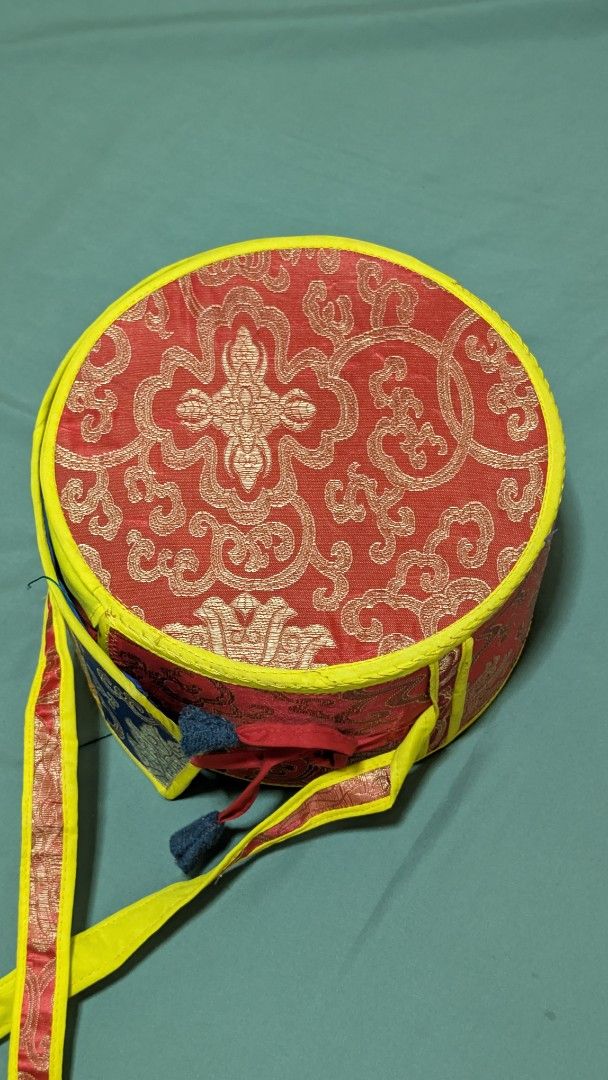 Tibetan Chod Damaru Drum with Case (Category: Musical Instruments) located in San Pedro. Submitted by leeeon_ (Listing ID 1464883985, Image 3). Description: - Item: Authentic Tibetan Chod damaru (double-headed ritual drum) I bought overseas - Condition: Clean and well-maintained overall - Appearance: Turquoise painted wooden shells adorned with cowrie shell ornaments - Accessories: Includes long colorful silk streamers with tassels - Storage: Com
