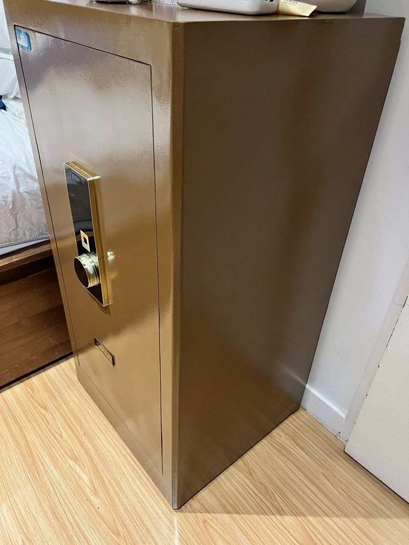 Tiger Professional Safe Bronze Security Cabinet (Category: Safe) located in Taguig. Submitted by fifileen (Listing ID 1464890427, Image 2). Description: Tiger Professional Security Safe in bronze. Heavy-duty steel with digital keypad and dial lock. Ideal for cash, docs, and valuables. Floor-standing model. Self-collection only. 100 cm tall x 50cm length x45 cm width .