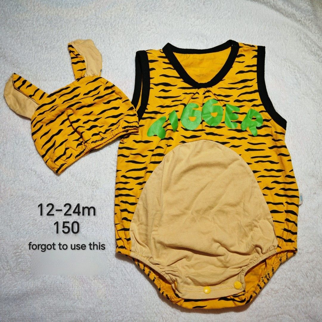 Tigger baby romper with matching hat 12-24m (Category: Babies & Kids Fashion) located in Quezon City. Submitted by maypamor (Listing ID 1464864465, Image 1). Description: - Size: 12-24 months - Condition: Brand new, never worn (gifted and forgotten) - Design: Orange and black tiger stripes with matching ear hat - Details: Green 'Tigger' lettering on chest and light tan belly patch - Convenience: Snap buttons at the bottom for quick and easy diape