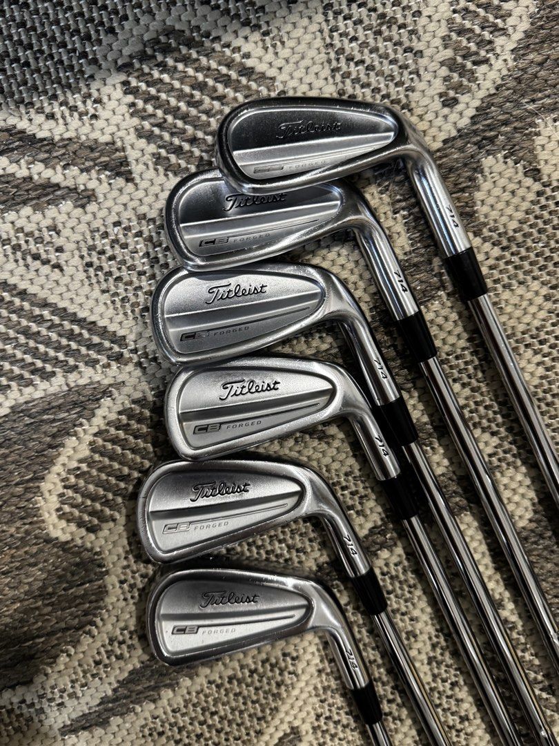 Titleist 714 CB Forged Irons Set (Category: Golf) located in Manila. Submitted by anpanmags (Listing ID 1464912738, Image 2). Description: - Model: Titleist 714 CB Forged Iron Set (numbers visible on hosels) - Design: Cavity back with traditional muscle channel - Shafts: Steel shafts with red shaft bands - Grips: Golf Pride multi-compound grips installed - Condition: Normal bag chatter and face wear from standard play, clean grooves ready for the