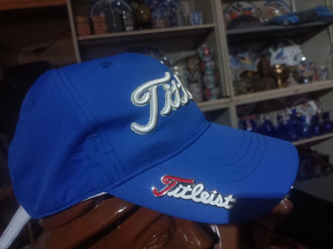 Titleist Blue Cap (Category: Caps & Hats) located in Munoz. Submitted by larryc1212 (Listing ID 1464900283, Image 1). Description: - Authentic Titleist cap in vibrant bright blue - Bold, raised white embroidery on the front panels - Stylish metal Titleist logo securely pinned on the brim side - Matching embroidery details above the adjustable back closure - Clean structured crown with branded interior seam taping - Convenient and adjustable velcr