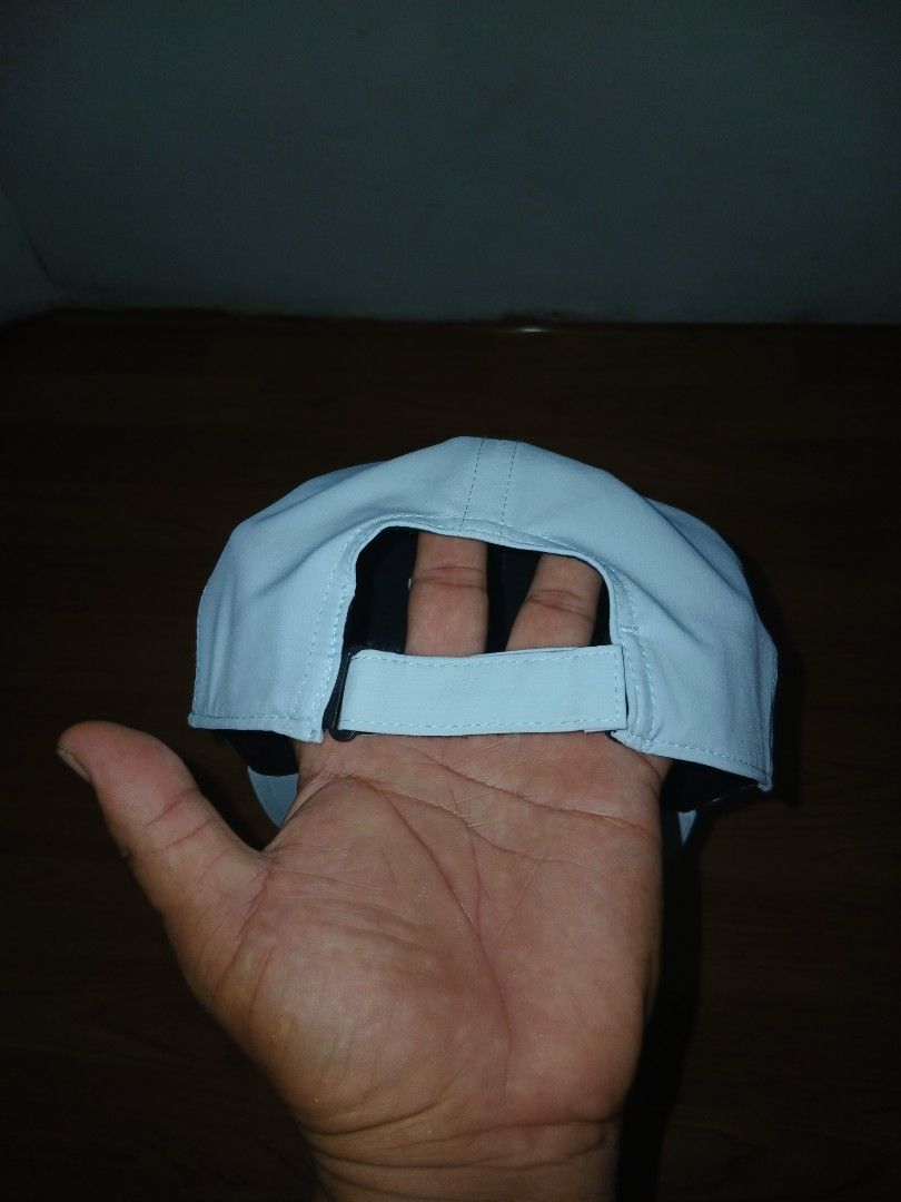 Titleist Golf Cap Light Blue Adjustable (Category: Caps & Hats) located in General Santos City (Dadiangas). Submitted by afsph1996 (Listing ID 1464872023, Image 2). Description: - Brand: Titleist -Size Medium to Large - Color: Light blue with white raised embroidered lettering - Fit: Adjustable velcro strap closure in the back - Material: 91% polyester, 9% spandex for comfort and stretch - Details: Features a black sweatband with repeating brand 