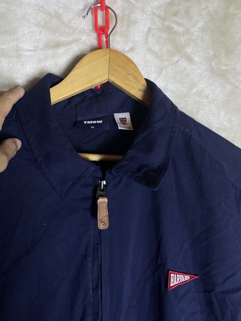 TMRW Harvard Navy Blue Zip Jacket XL (Category: Coats, Jackets and Outerwear) located in Molave. Submitted by charlesthrifter (Listing ID 1464895935, Image 2). Description: - Brand/Model: TMRW navy blue zip jacket - Size: XL - Design: Embroidered Harvard pennant logo on chest - Features: Full front zipper with leather pull tab, 2 front pockets - Condition: Clean, solid basic layer for cooler weather.