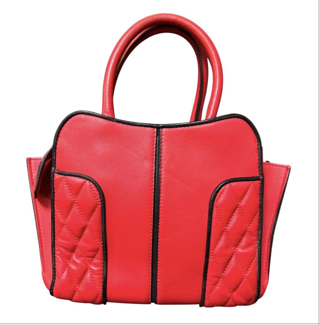 Tod's Red Leather Handbag (Category: Tote Bags) located in Baguio. Submitted by pwz-eshop (Listing ID 1464826470, Image 3). Description: • Please take time to read. • I do not have when worn pictures, please rely on actual dimensions for sizing. • Up for Grabs!! • Guaranteed Authentic!! • Flaws: Missing sling. Rubs on pipings. Scraped off leather edges on handles. Minor stains. (please see photos) • BRAND: Tod's. • DIMENSIONS: length 12", height 