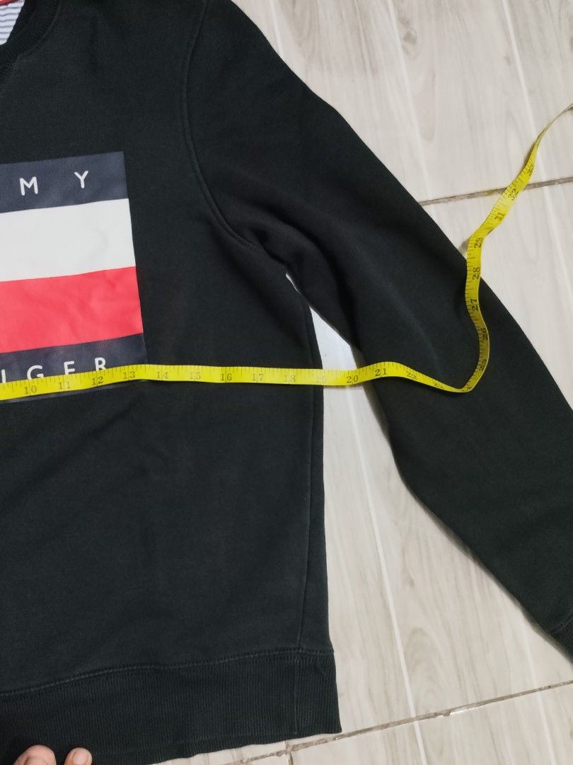Tommy Hilfiger Black Logo Sweatshirt (Category: Coats, Jackets and Outerwear) located in Caloocan City. Submitted by moneyhunt25 (Listing ID 1464850925, Image 2). Description: Authentic black Tommy Hilfiger crewneck sweatshirt in size small. Features the iconic logo across the chest, comfortable cotton-polyester blend, and stylish stripe detail inside the collar. Perfect for everyday wear. PM for measurements or inquiries! 09455776328.